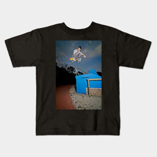 Skateboarder flying Kids T-Shirt by homydesign